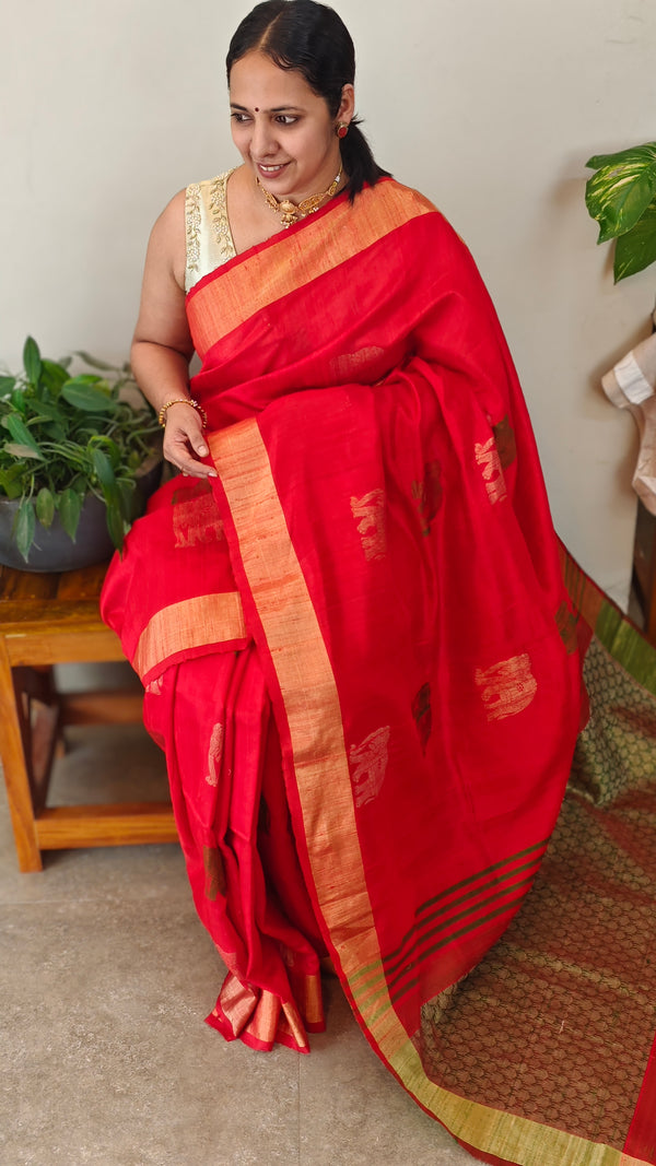 Reddish orange raw silk saree with elephant motifs
