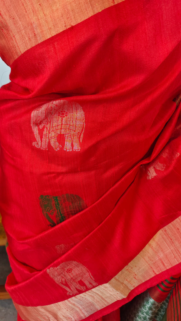 Reddish orange raw silk saree with elephant motifs