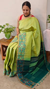 713HH - Light green and dark green raw silk saree with ikat borders