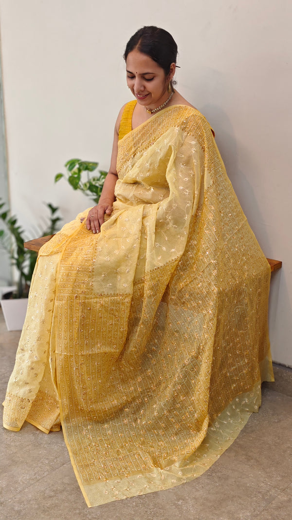 Yellow embroidered and block printed organza saree