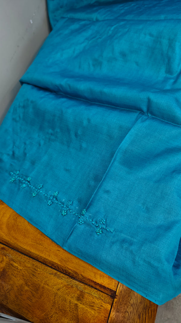 Cyan blue hand embroidered tussar silk saree