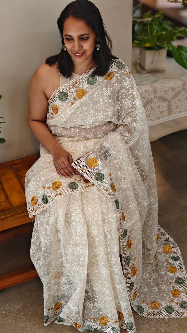 Off white cutwork saree with floral borders