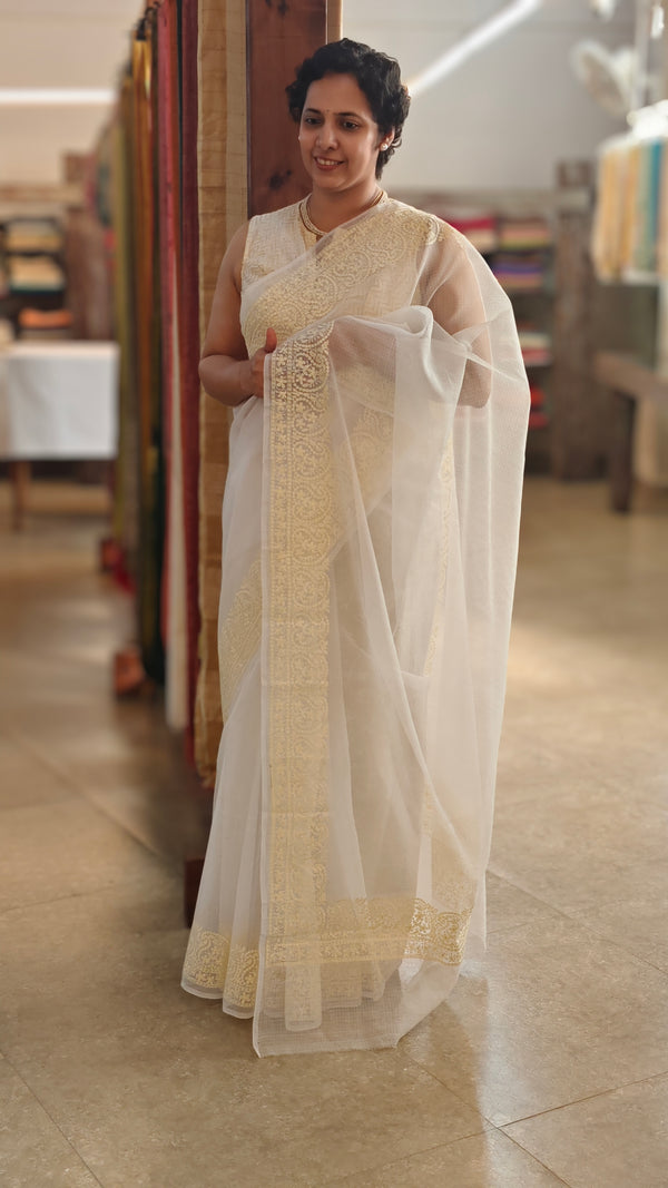Off white and light yellow net kota saree