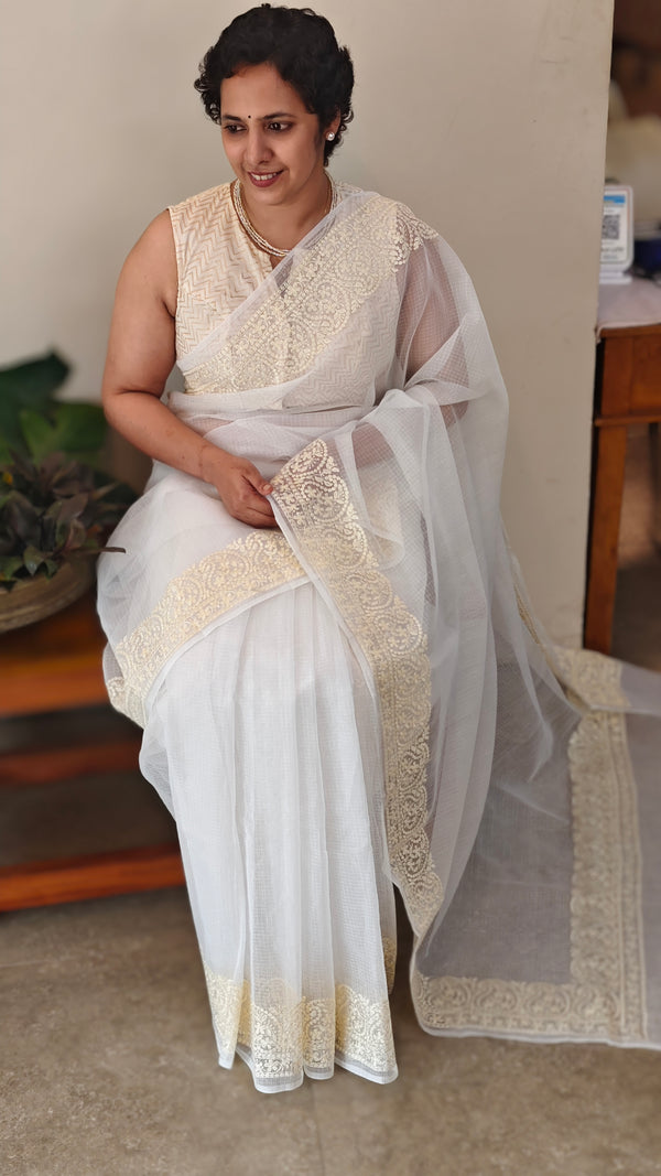 Off white and light yellow net kota saree