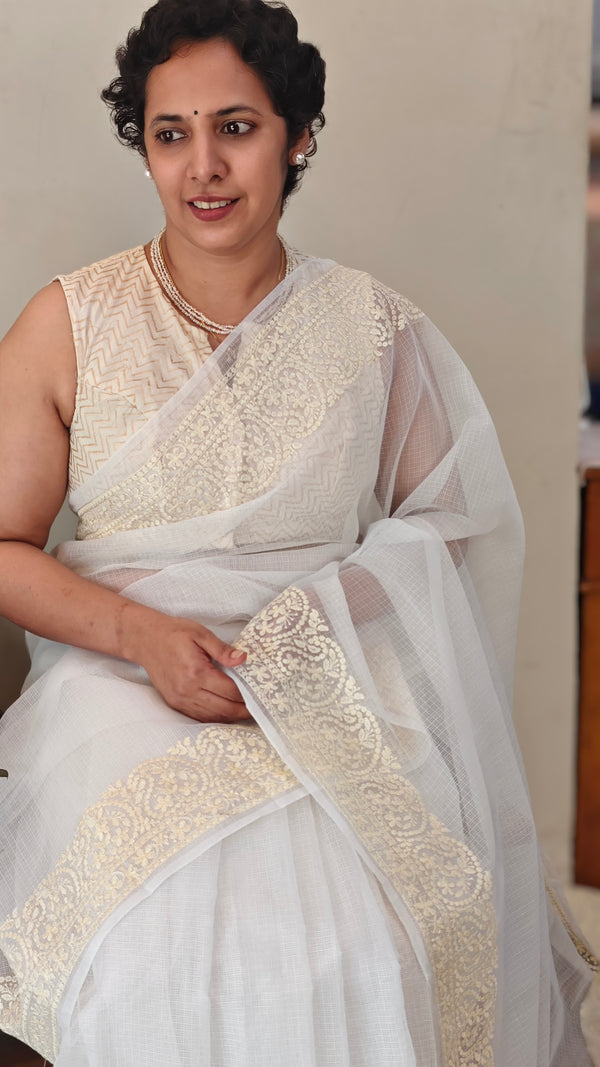 Off white and light yellow net kota saree
