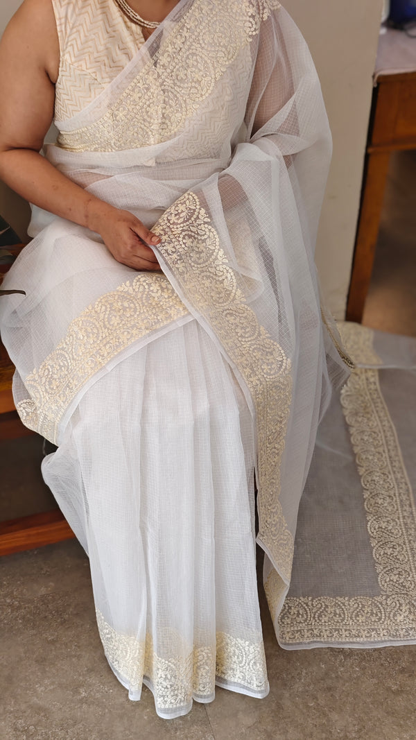 Off white and light yellow net kota saree
