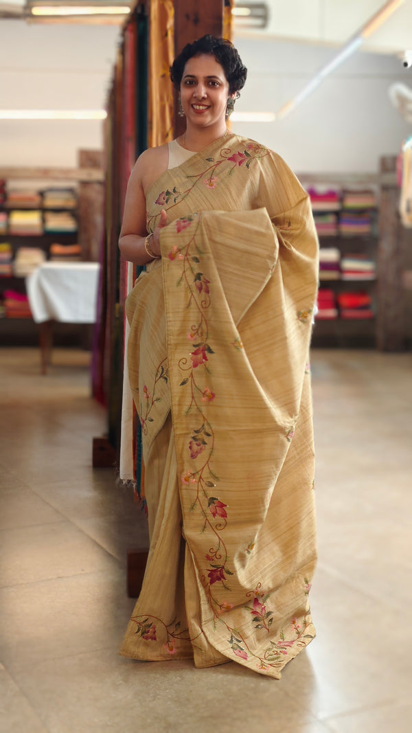 Beige semi tussar silk saree with hand embroidery