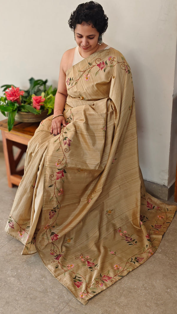Beige semi tussar silk saree with hand embroidery