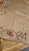 Beige semi tussar silk saree with hand embroidery