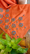 Orange muslin silk saree with hand embroidery