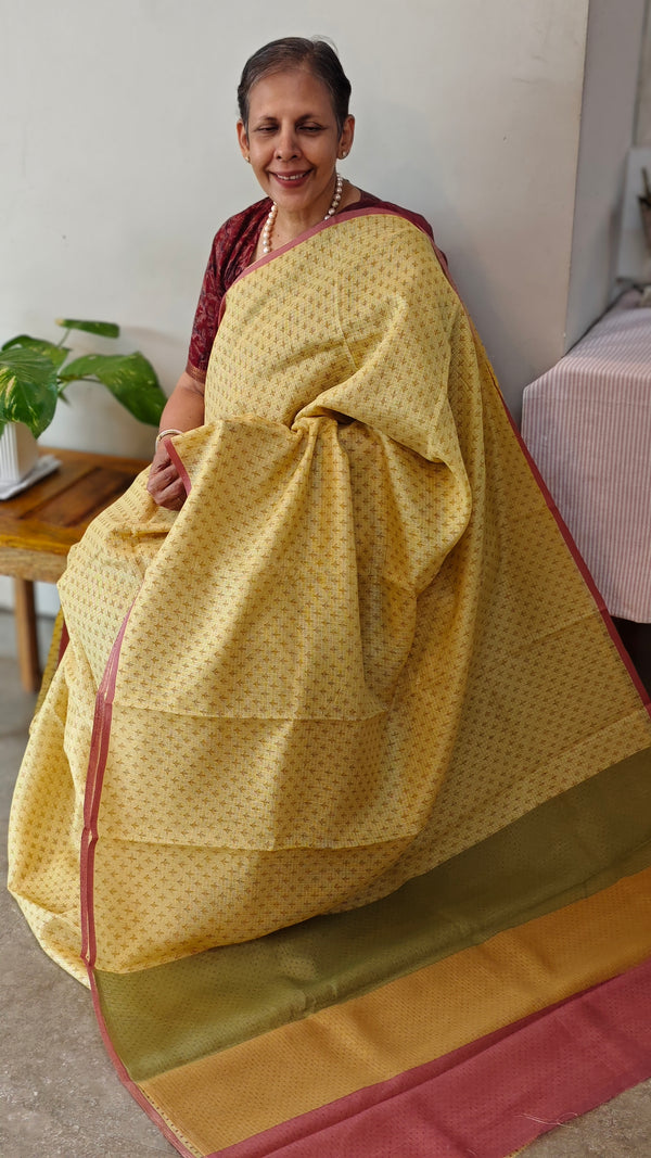 Pale yellow printed silky kota saree