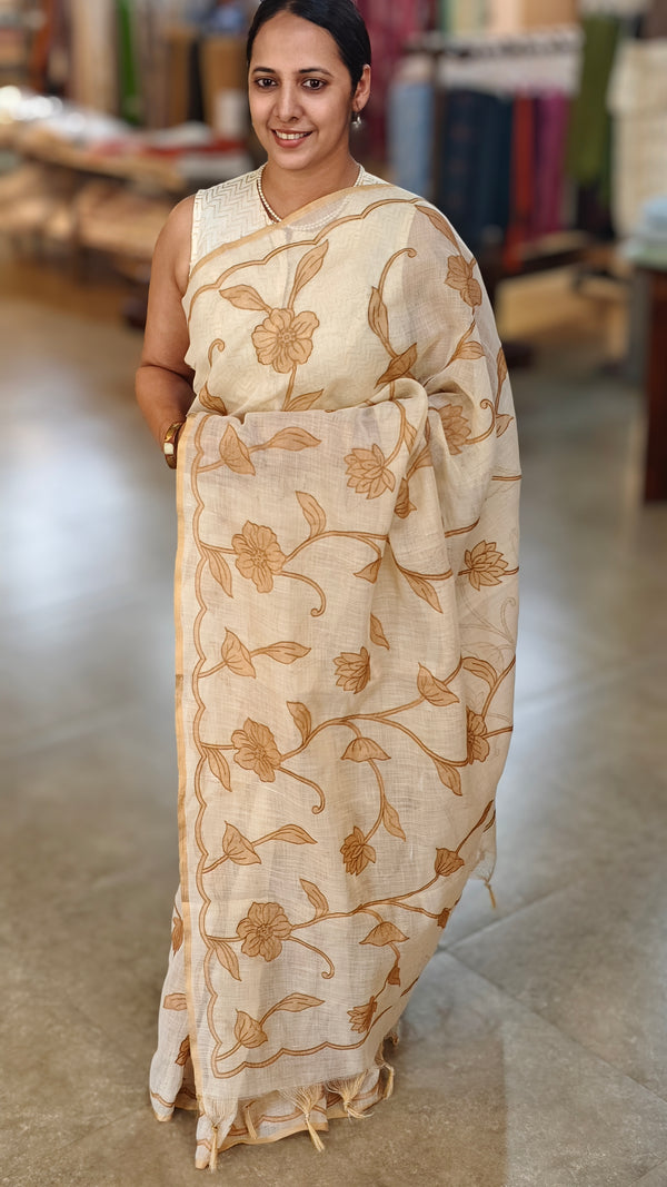 Off white linen tissue saree with brown applique