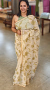 Off white linen tissue saree with green applique