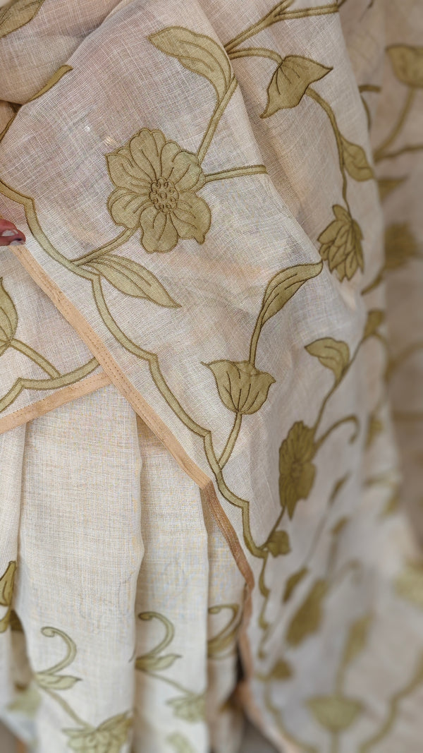 Off white linen tissue saree with green applique