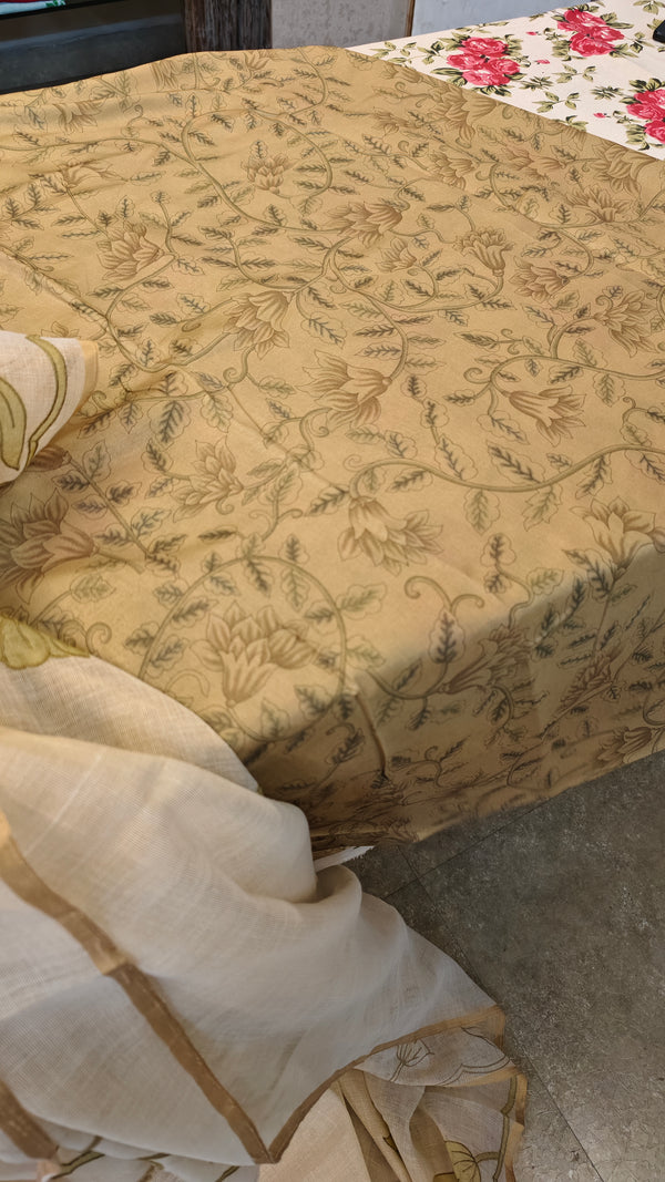 Off white linen tissue saree with green applique