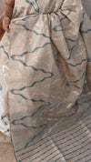 Beige and green jamdani saree