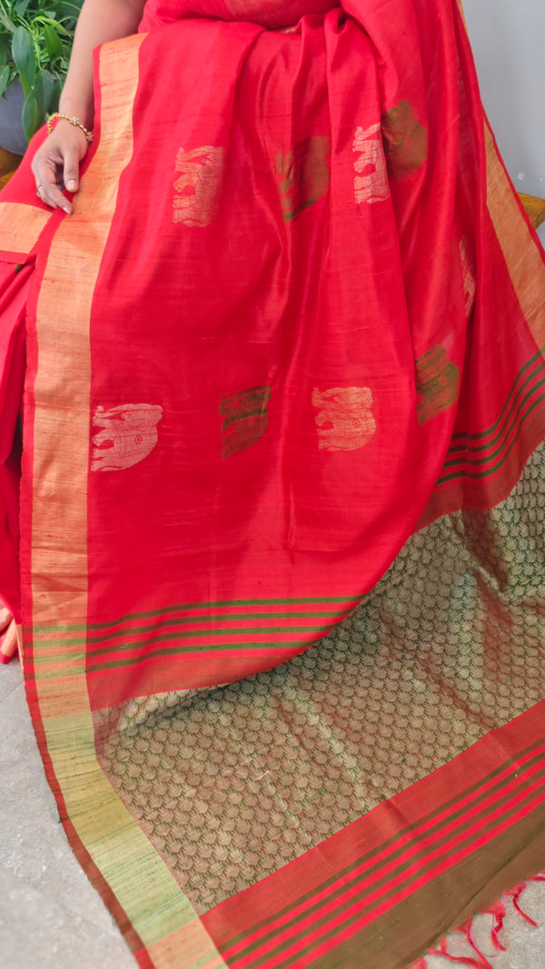 Reddish orange raw silk saree with elephant motifs