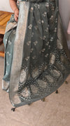Muted moss green banarasi crepe saree