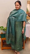 Dark green woven tussar silk suit