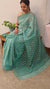 Teal green block printed organza saree