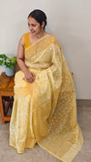 Yellow embroidered and block printed organza saree