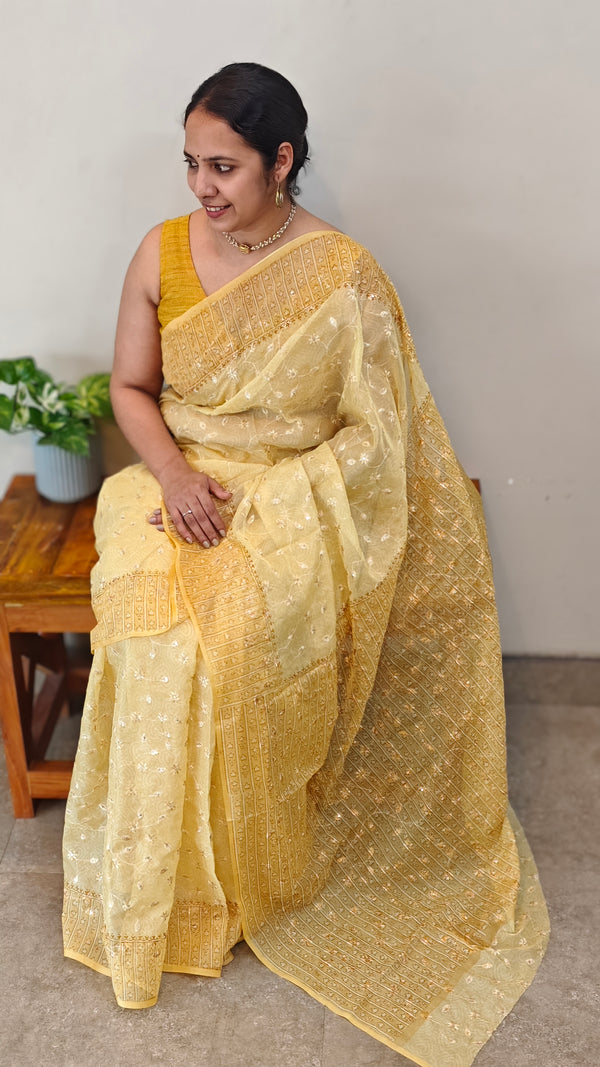 Yellow embroidered and block printed organza saree