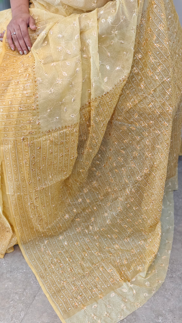 Yellow embroidered and block printed organza saree