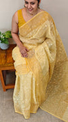 Yellow embroidered and block printed organza saree