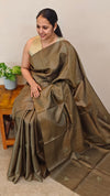 Metallic green tussar silk saree with hand embroidery