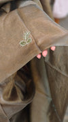 Metallic green tussar silk saree with hand embroidery