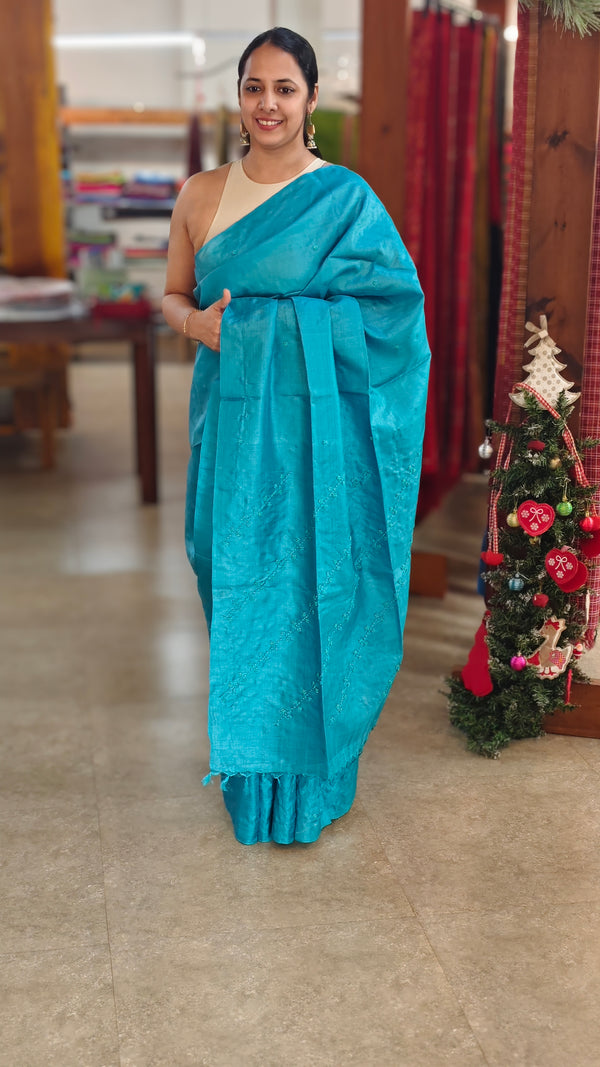 Cyan blue hand embroidered tussar silk saree