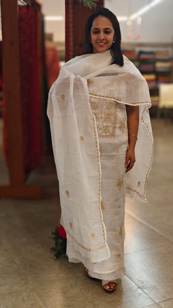 Beige chikankari on off white net kota suit