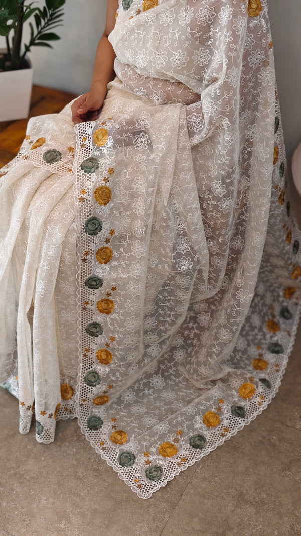 Off white cutwork saree with floral borders