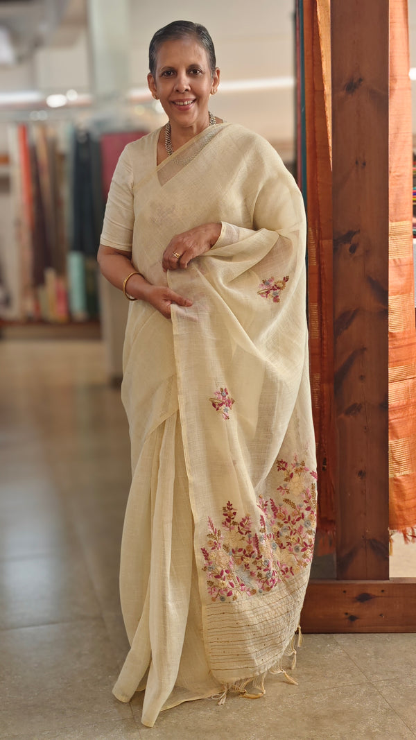Cream linen tissue hand embroidered saree