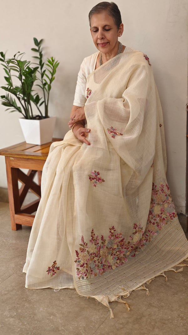 Cream linen tissue hand embroidered saree